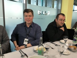 At lunch time, Rustem Khassanov (right) reflects on the advice of Konstantin Kamenev (left).
